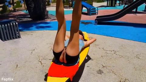Midlife woman shows her bod at outdoor stadium