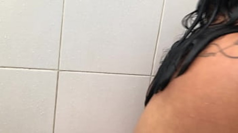  Busty lady pleasures herself in the restroom