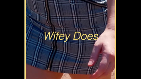 MILF shows her shaved pussy in public
