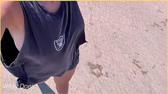 wife struts barefoot with side boob on crowded beach