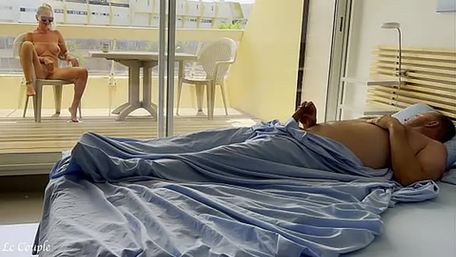 Naked wife was already watching nudists on street when husband woke in the morning